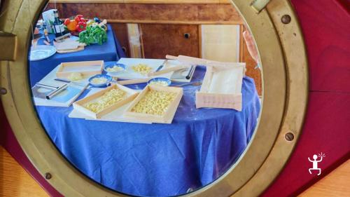 Panoramic boat tour and cooking class in Castellammare di Stabia: make Spaghetti alla Chitarra and lunch with traditional sauces, ideal for groups