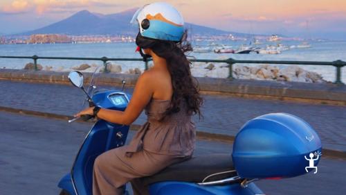 Panoramic Vespa tour through the streets of Naples at sunset, ideal for couples and small groups