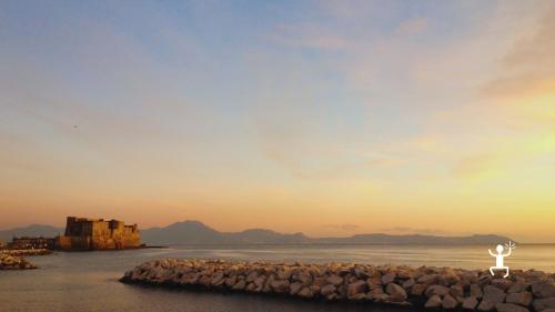 Departure by Vespa from the Santa Lucia district to discover Naples at sunset, ideal for Italian and international tourists