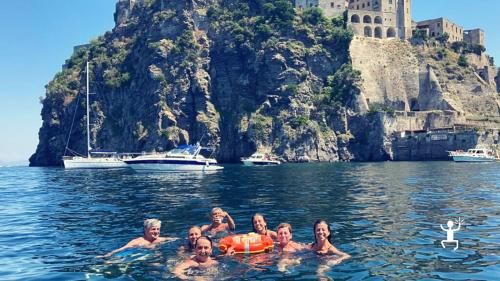 Bachelor and bachelorette party experience in Campania, Ischia, Gulf of Naples, with aperitif and music on board