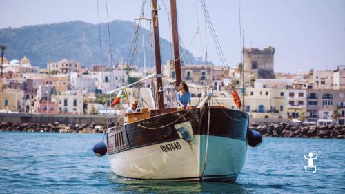 Sunset sailing boat dinner experience for couples in Ischia – romantic evening and moonlight swim